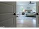 View of the large main bedroom with seating area, tray ceiling, and stylish decor at 3785 Pilgrim Mill Rd, Cumming, GA 30041