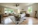 Light-filled main bedroom with hardwood floors, sitting area, ceiling fan, and neutral paint at 3785 Pilgrim Mill Rd, Cumming, GA 30041