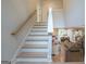 Staircase to the second floor with view to the great room, living room, and dining room at 3785 Pilgrim Mill Rd, Cumming, GA 30041