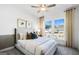 Comfortable bedroom with plush bedding, abundant natural light, and neutral decor at 120 Aj Welch Jr Way, Mcdonough, GA 30252