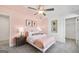 Cozy bedroom with soft pink walls, comfortable bed, and stylish decor at 120 Aj Welch Jr Way, Mcdonough, GA 30252