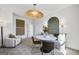 Chic dining area with a round marble table, stylish chairs, and decorative lighting at 120 Aj Welch Jr Way, Mcdonough, GA 30252