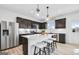 Modern kitchen with stainless steel appliances, white countertops, and a large center island at 120 Aj Welch Jr Way, Mcdonough, GA 30252