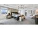 Luxurious main bedroom with a tray ceiling, elegant furnishings, and a spa-like en suite bathroom at 120 Aj Welch Jr Way, Mcdonough, GA 30252