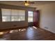 Spacious living room featuring hardwood floors, bright natural light, and access to the front entryway at 103 Emory Way, Oxford, GA 30054