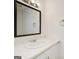 Bathroom vanity featuring a sink with marble countertop and a large mirror at 1314 N Lea Se Ct, Smyrna, GA 30080