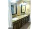 Bathroom with a double vanity with granite countertop and cabinets at 245 Ashley Forest Dr, Fayetteville, GA 30214