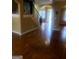 Foyer with hardwood floors, wrought iron staircase, and views to other rooms at 245 Ashley Forest Dr, Fayetteville, GA 30214