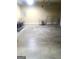 Spacious garage with overhead door and shelving, offering ample storage space at 245 Ashley Forest Dr, Fayetteville, GA 30214