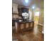 Kitchen island and eat-in area feature stainless steel appliances, and hardwood floors at 245 Ashley Forest Dr, Fayetteville, GA 30214
