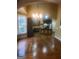 Eat-in kitchen featuring hardwood floors, an island, and stainless steel appliances at 245 Ashley Forest Dr, Fayetteville, GA 30214