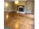 Bright living room features hardwood floors, fireplace, and natural light at 245 Ashley Forest Dr, Fayetteville, GA 30214