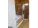 Tile-finished bathroom featuring a shower and separate tub at 245 Ashley Forest Dr, Fayetteville, GA 30214