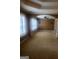 Expansive carpeted primary bedroom with windows, columns, and textured walls at 245 Ashley Forest Dr, Fayetteville, GA 30214