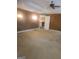 Large main bedroom featuring textured walls, ceiling fan, and a doorway to another room at 245 Ashley Forest Dr, Fayetteville, GA 30214