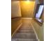Stairway featuring carpet steps and wooden handrail at 245 Ashley Forest Dr, Fayetteville, GA 30214