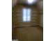 Walk-in closet with carpet flooring, bright window and multiple shelves at 245 Ashley Forest Dr, Fayetteville, GA 30214