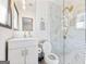 Elegant bathroom features a marble-tiled shower with gold hardware and a modern vanity at 3044 Sunset Ln, East Point, GA 30344