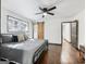 Bedroom with hardwood floors, ceiling fan, window, and dark trim at 3044 Sunset Ln, East Point, GA 30344