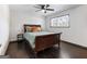 Bedroom featuring a wood bed frame, dark hardwood floors, and a large window at 3044 Sunset Ln, East Point, GA 30344