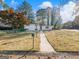 Charming single-story home with well-maintained lawn and walkway to entrance at 3044 Sunset Ln, East Point, GA 30344