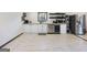 Kitchen featuring white cabinets, stainless steel appliances, and floating shelves at 3044 Sunset Ln, East Point, GA 30344