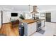 Spacious open-concept kitchen and living area with island cooktop and modern finishes at 3044 Sunset Ln, East Point, GA 30344