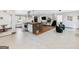 Open floor plan featuring tile and wood floors, kitchen island, and modern furnishings at 3044 Sunset Ln, East Point, GA 30344