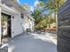 Backyard patio with a seating area and view of mature trees and the exterior of the home at 3044 Sunset Ln, East Point, GA 30344