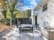 Backyard patio with seating, string lights, and privacy fence at 3044 Sunset Ln, East Point, GA 30344