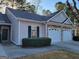Charming home featuring a two-car garage, stone accents, and well-maintained landscaping at 181 Linton Dr, Acworth, GA 30102