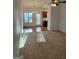 Spacious living room filled with sunlight, featuring plush carpeting and dining area at 181 Linton Dr, Acworth, GA 30102