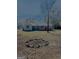 Home's backyard includes fire pit, a lawn, and a small back porch at 23 Hampton Locust Grove Rd, Hampton, GA 30228