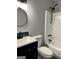 A bright, updated bathroom with sleek fixtures, a vanity, and a shower-tub combination at 23 Hampton Locust Grove Rd, Hampton, GA 30228