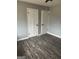The bedroom with hardwood floors has two doors and is ready for personalization at 23 Hampton Locust Grove Rd, Hampton, GA 30228
