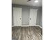 Spacious bedroom featuring new wood floors and two closets for ample storage, move-in ready at 23 Hampton Locust Grove Rd, Hampton, GA 30228
