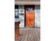 Front door close-up showcases a vibrant door, stylish lantern, and classic house number at 23 Hampton Locust Grove Rd, Hampton, GA 30228