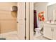 Bathroom with a toilet and shower with a shower curtain featuring floral design at 429 Stagecoach Bnd, Smyrna, GA 30080