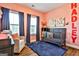 Cozy Bedroom featuring a crib, plush rug, chair, and decor in soft colors at 429 Stagecoach Bnd, Smyrna, GA 30080