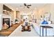 Stylish living room with fireplace, modern furniture, ceiling fan, and view to the kitchen at 429 Stagecoach Bnd, Smyrna, GA 30080