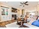 Open concept living room with fireplace, built-ins, modern furniture, and natural light at 429 Stagecoach Bnd, Smyrna, GA 30080