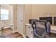 Office nook features a hardwood floor, white door, and a desk with cabinets for storage at 429 Stagecoach Bnd, Smyrna, GA 30080