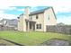 Spacious backyard with a well-maintained lawn and a view of the home's exterior at 207 Birchwood Dr, Loganville, GA 30052