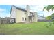 Spacious backyard with a well-maintained lawn and a cozy patio area, perfect for outdoor entertaining at 207 Birchwood Dr, Loganville, GA 30052