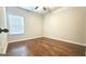Cozy bedroom with hardwood floors and a window for natural light at 207 Birchwood Dr, Loganville, GA 30052