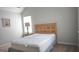 A cozy bedroom features a full-size bed and neutral walls, ready for personalization at 207 Birchwood Dr, Loganville, GA 30052