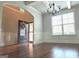 Elegant foyer with hardwood floors, large window and a front door with a floral wreath at 207 Birchwood Dr, Loganville, GA 30052