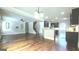 Spacious open-concept living area showcasing stairs, kitchen, and fireplace at 207 Birchwood Dr, Loganville, GA 30052