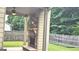Patio featuring an outdoor stone fireplace, providing comfort and charm to the outdoor area at 207 Birchwood Dr, Loganville, GA 30052