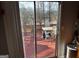 View through sliding glass door onto backyard deck and lake at 1213 Harvest Dale Ct, Stone Mountain, GA 30088